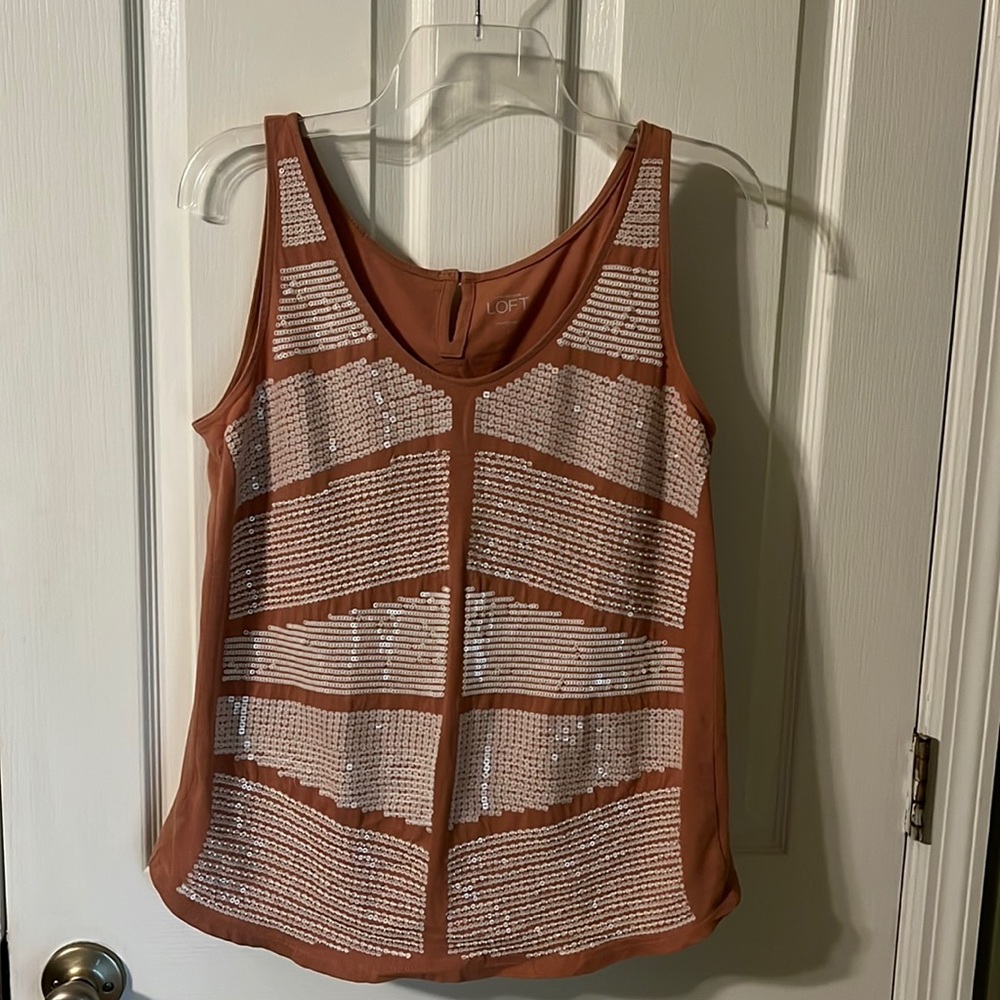 Loft tank with embellishment